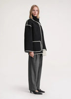 Jacke Damen schwarz weit mit Taschen und Fransen - 14 - Atelier-Zofia